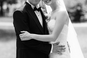 the groom in a brown suit and the bride in a white dress, a Person Photo by Weddings, People, Travel