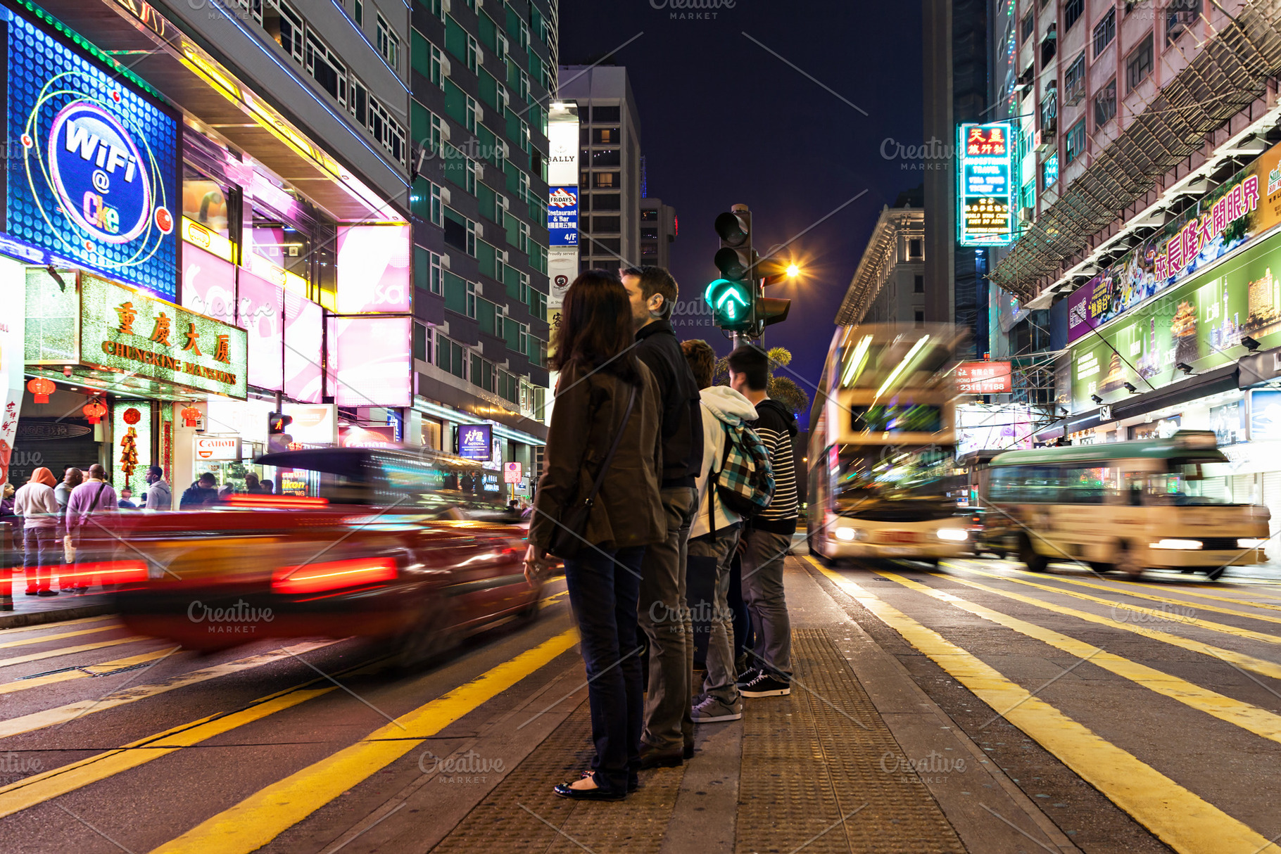 Pedestrians crossing road, a Photo by saiko3p