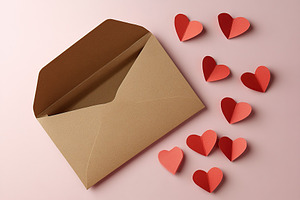 Valentines letter envelope with paper hearts, a Holiday Photo by AlyaAnd
