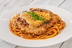 Crispy Chicken Parmesan served over, a Food & Drink Photo by Alexander Prokopenko