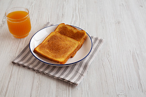 Homemade American Cinnamon Toast with Butter and Orange Juice, s, a Food & Drink Photo by LiudmylaChuhunova