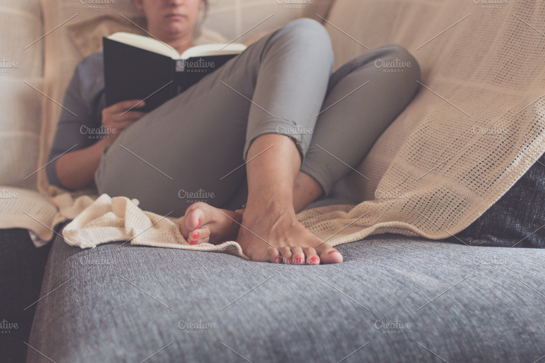 On the couch, a Person Photo by Tan Tranquila