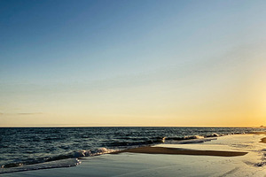 Sunset over a calm Florida Pensacola beach with gentle waves and golden light, a Nature Photo by AS photostudio