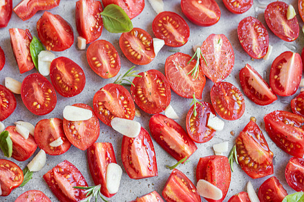 Fresh tomato slices with herbs, a Food & Drink Photo by Olena Rudo
