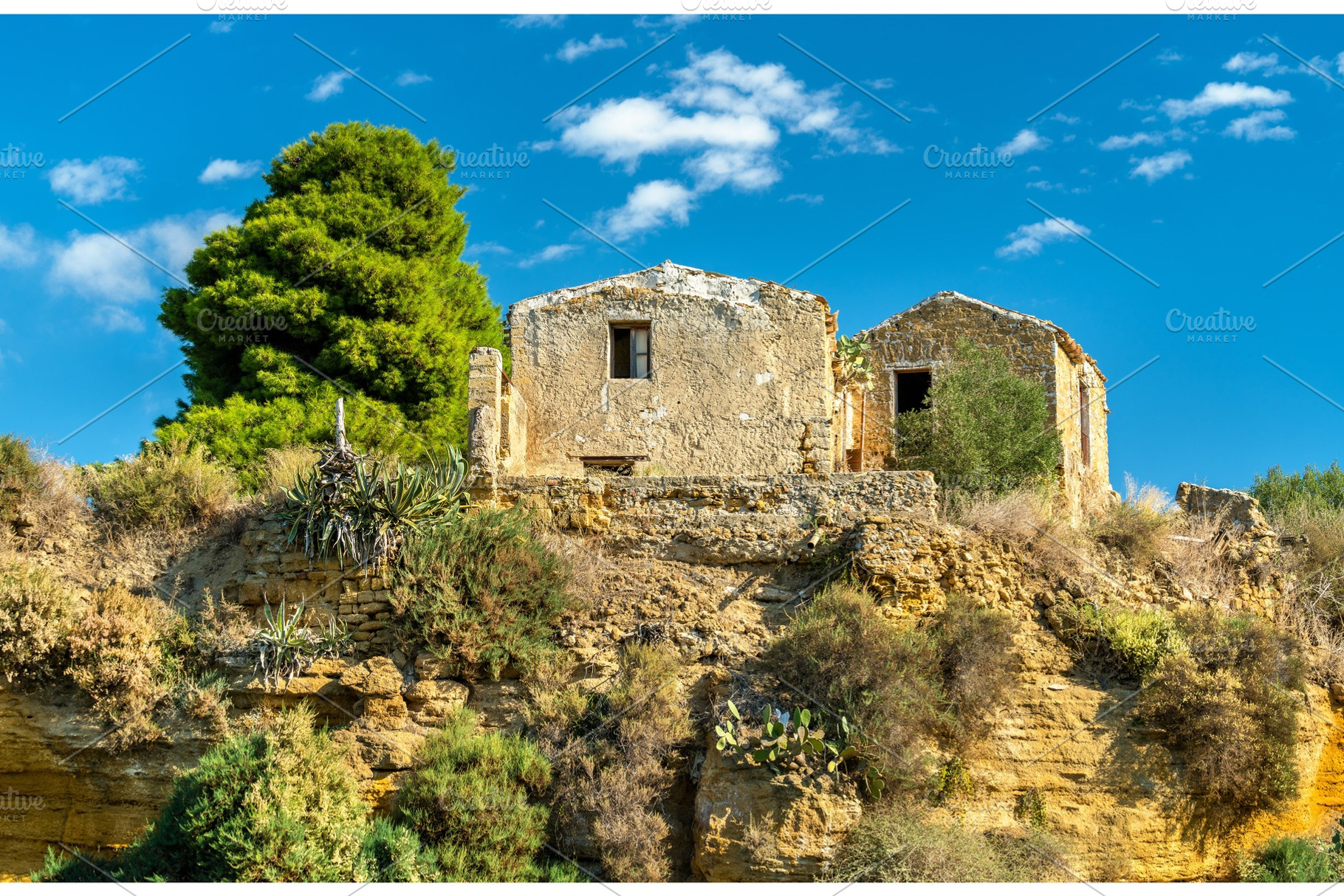 Ancient houses in the gardens of the Valley of the Temples - Agrigento, Sicily, an Architecture Photo by Leonid Andronov