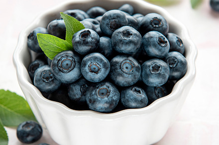Blueberries on tile background, a Food & Drink Photo by Olena Rudo