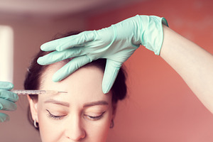 smoothing facial wrinkles with Botox
