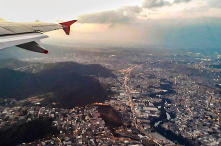 Window plane flying over guayaquil city, a Transportation Photo by DanFLCreativo