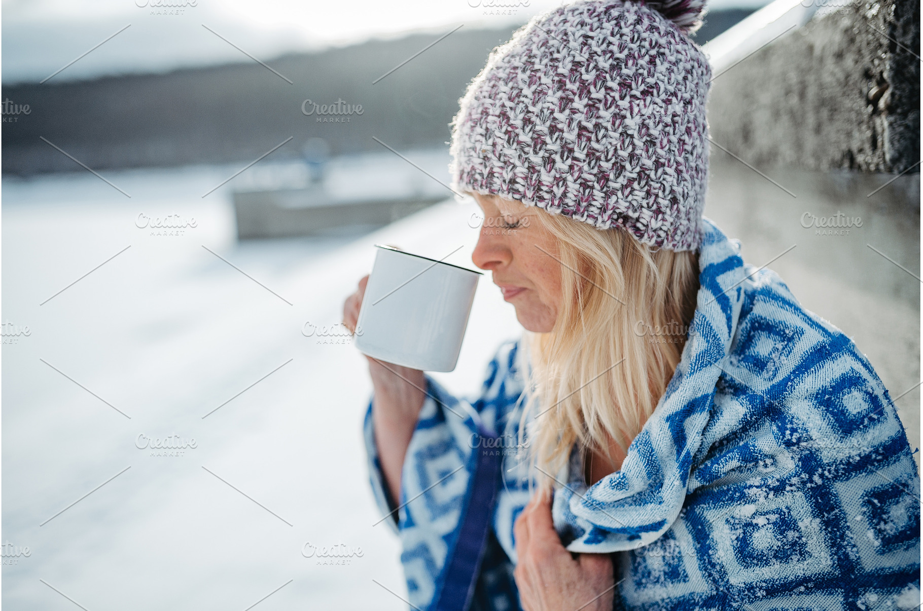 Senior woman enjoying cup of tea in, a Holiday Photo by HalfPoint