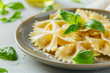A plate of cooked farfalle pasta gar, a Photo by Tanuart