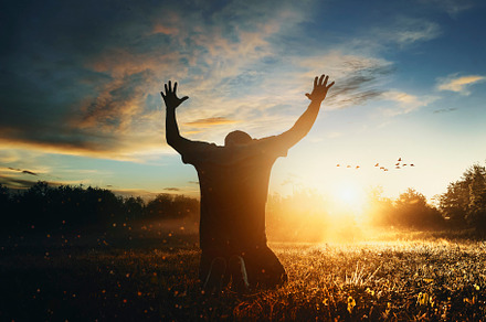 Man raising his hands in worship, a Holiday Photo by Javier Art Photography