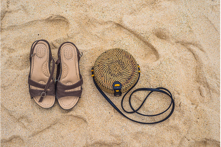 Sandals and Balinese wicker bag on, a Holiday Photo by Elizaveta Galitskaya