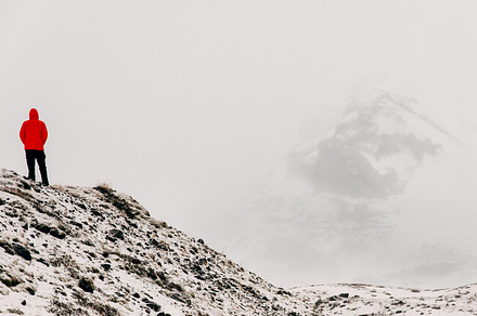 Man walking in snowy landscape stock photo containing winter and roadtrip, a Holiday Photo by PhotoMarket
