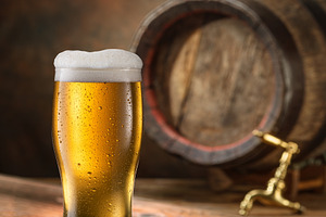Glass of beer and wooden beer cask, a Food & Drink Photo by Volff
