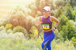 Young slim woman running trail race featuring ultrarunner, run, and
