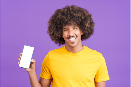 Happy african man holding a mobile, a Person Photo by Iván Moreno STOCK PHOTO