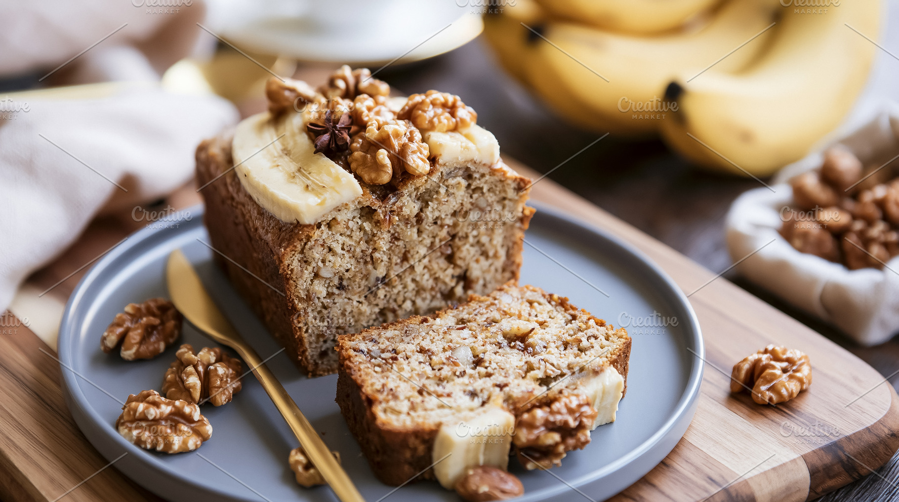 Banana bread loaf with a slice cut, topped with walnuts and banana. Perfect swe, a Photo by Studio ANNA