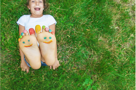Children's feet with a pattern of, a Nature Photo by yanadjana