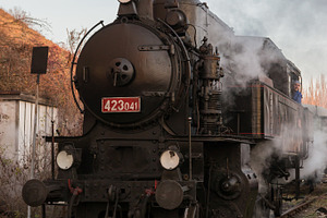 Steam train at the station stock photo containing locomotive and smoke