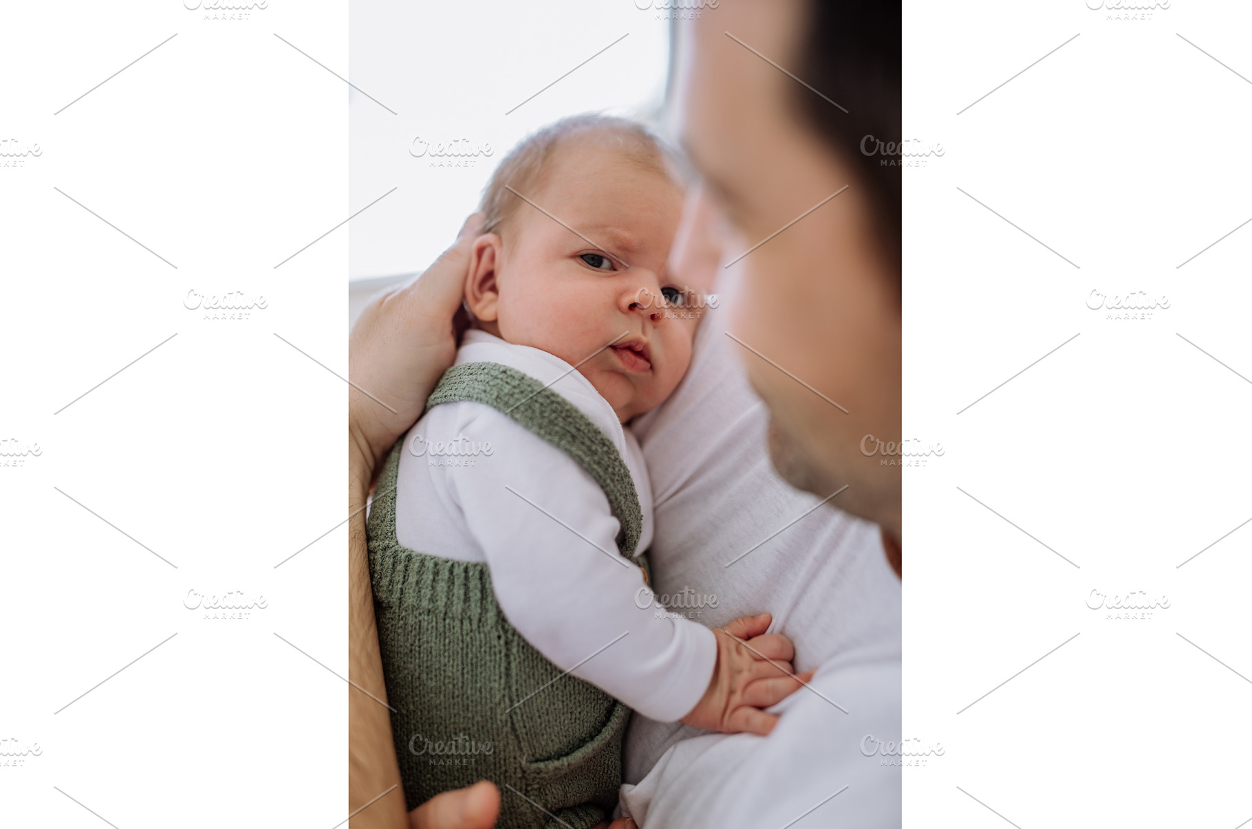 Close-up of father holding his, a Person Photo by HalfPoint