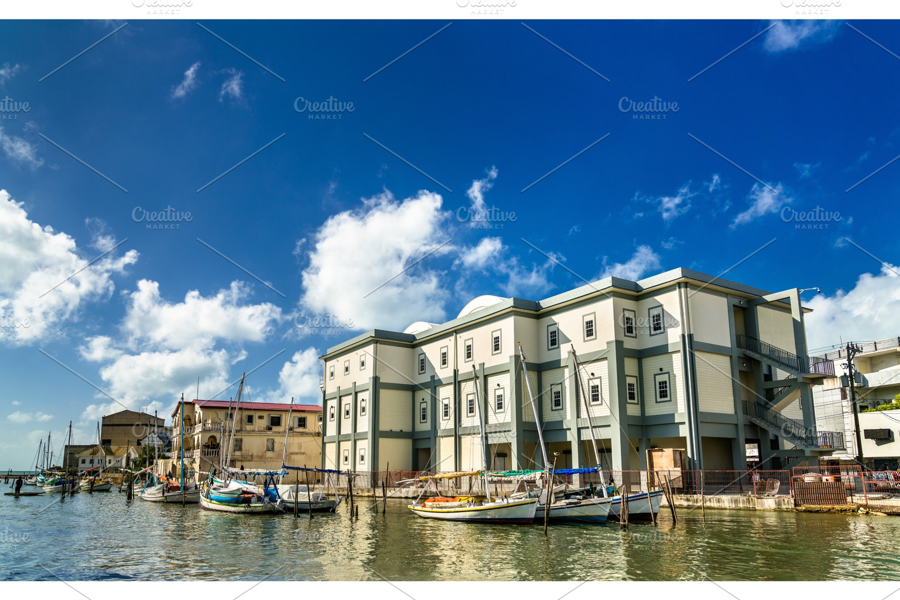 Houses and yachts at haulover creek stock photo containing belize and panorama, an Architecture Photo by Leonid Andronov