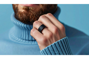 Bearded man wearing black smart ring, a Technology Photo by Igor Tichonow