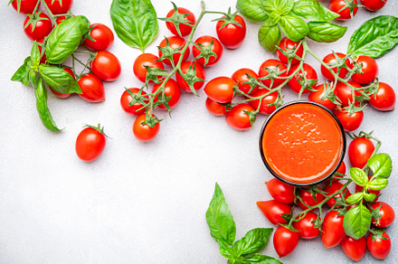 Freshly squeezed tomato juice in a glass and red cherry tomatoes, a Food & Drink Photo by 5PH