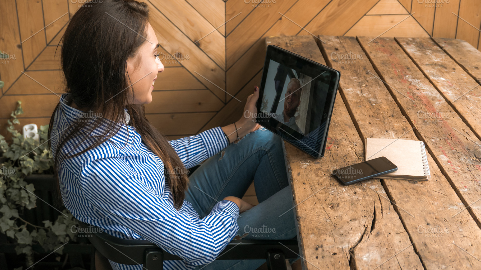 Having video call with a friend stock photo containing female and woman, a Person Photo by supamotion