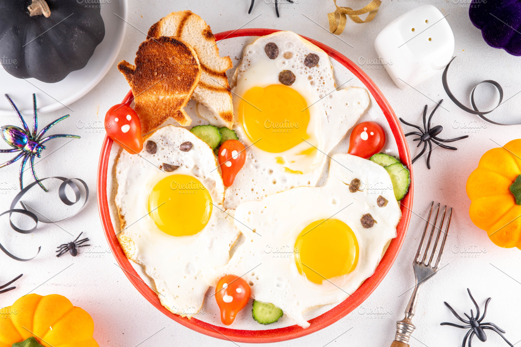 Halloween breakfast food, ghost shaped fried eggs, toasts and sa, a Food & Drink Photo by Rimma