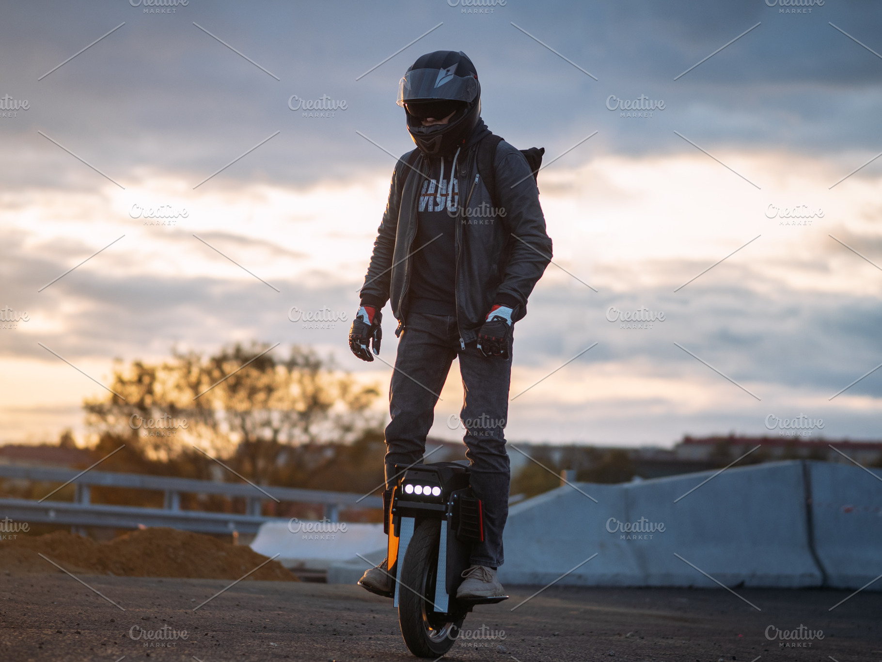 A man rides on an electric unicycle. Mono Wheel riding (EUC) , protective gear, a Person Photo by PavelKant