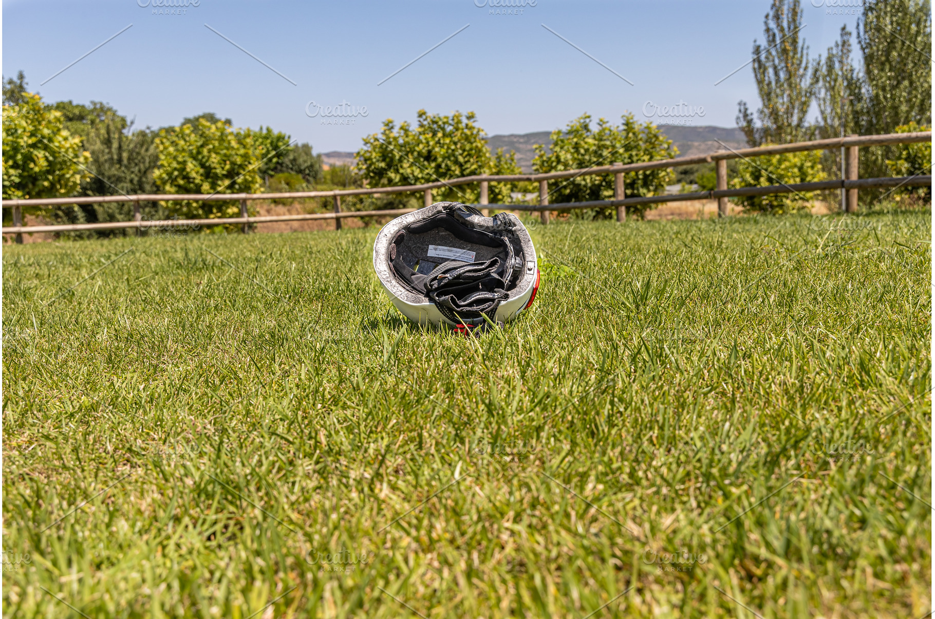A white helmet on the green grass, a Technology Photo by Illustrations&photos