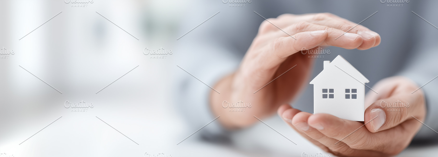 Hands gently holding a small house, a Business Photo by MistyDay