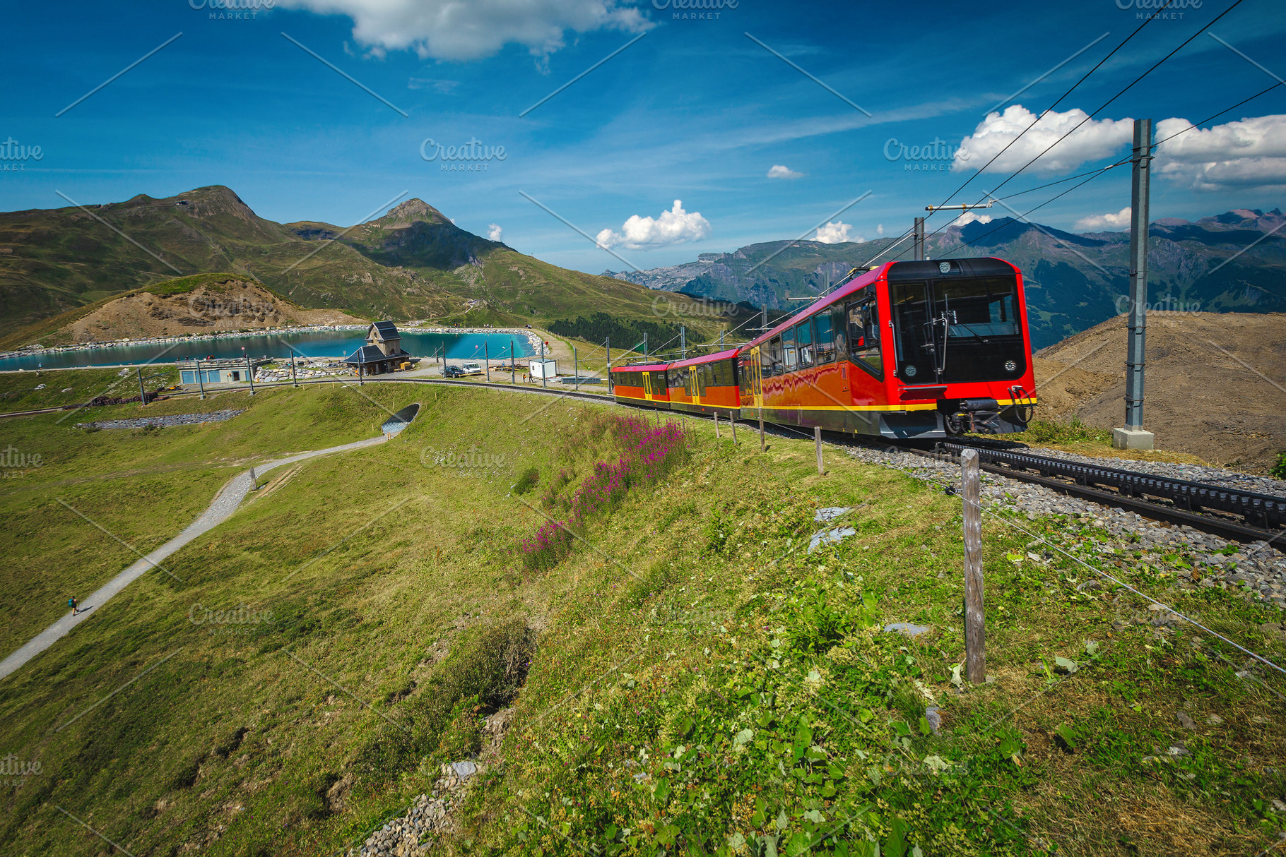 Red tourist train and mountain lake, a Transportation Photo by Alpine Dreams