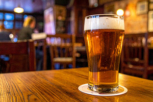 pint of ale in pub AI generated, a Photo by WorldOfPhotos