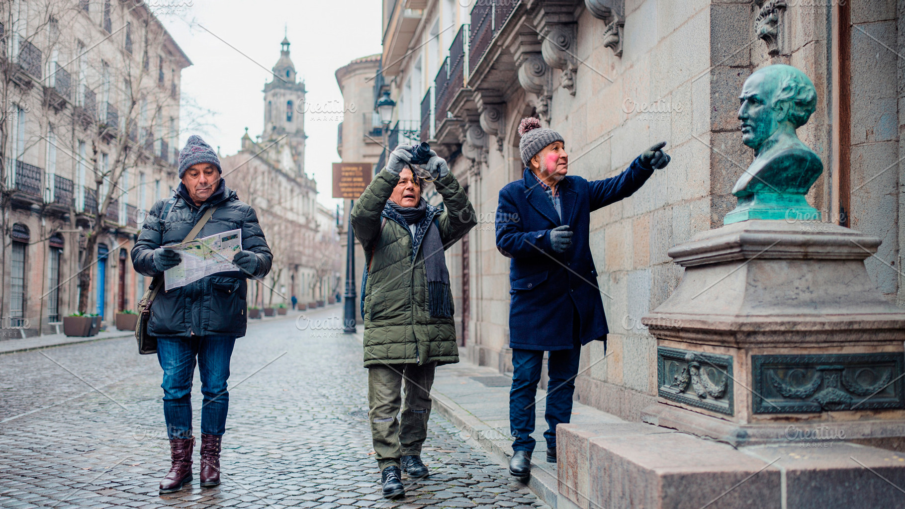 Mature men travelers exploring a historic urban district in wint, a Person Photo by DanFLCreativo