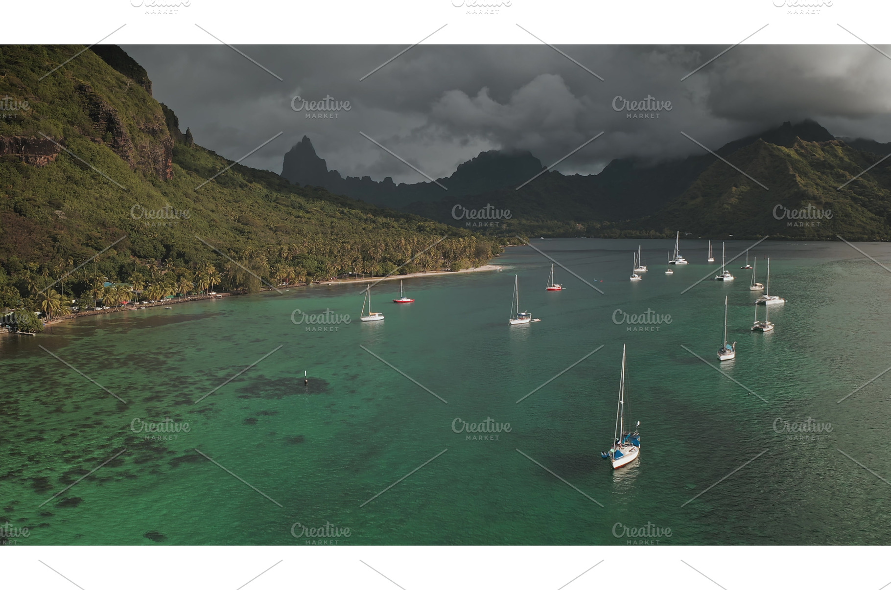 Sailboats anchoring in Opunohu bay, a Transportation Photo by Goinyk
