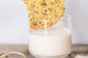 Eating cookies healthy food flax hand yogurt glass, a Person Photo by Photo Drive Studio