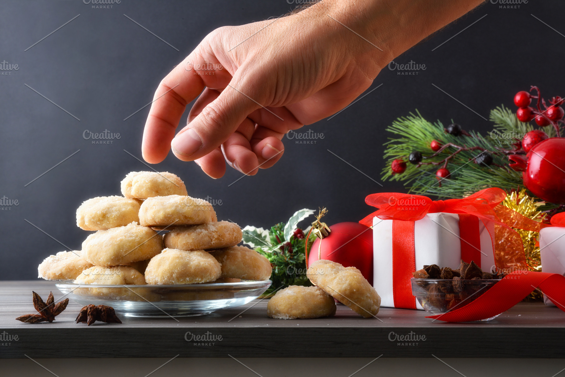 Tasting anise cookies on table with Christmas decorations dark b, a Food & Drink Photo by Davizro's Market