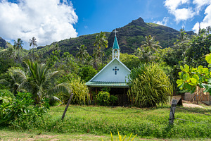 Small church in Anaho Bay, Nuku Hiva, French Polynesia, amid lus, an Architecture Photo by GoodGoods