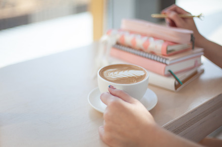 Female hands using mobile phone for organising schedule while dr