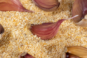 garlic fruits for cooking close up, dried spices from very small pieces of garl, a Photo by rsoollAI