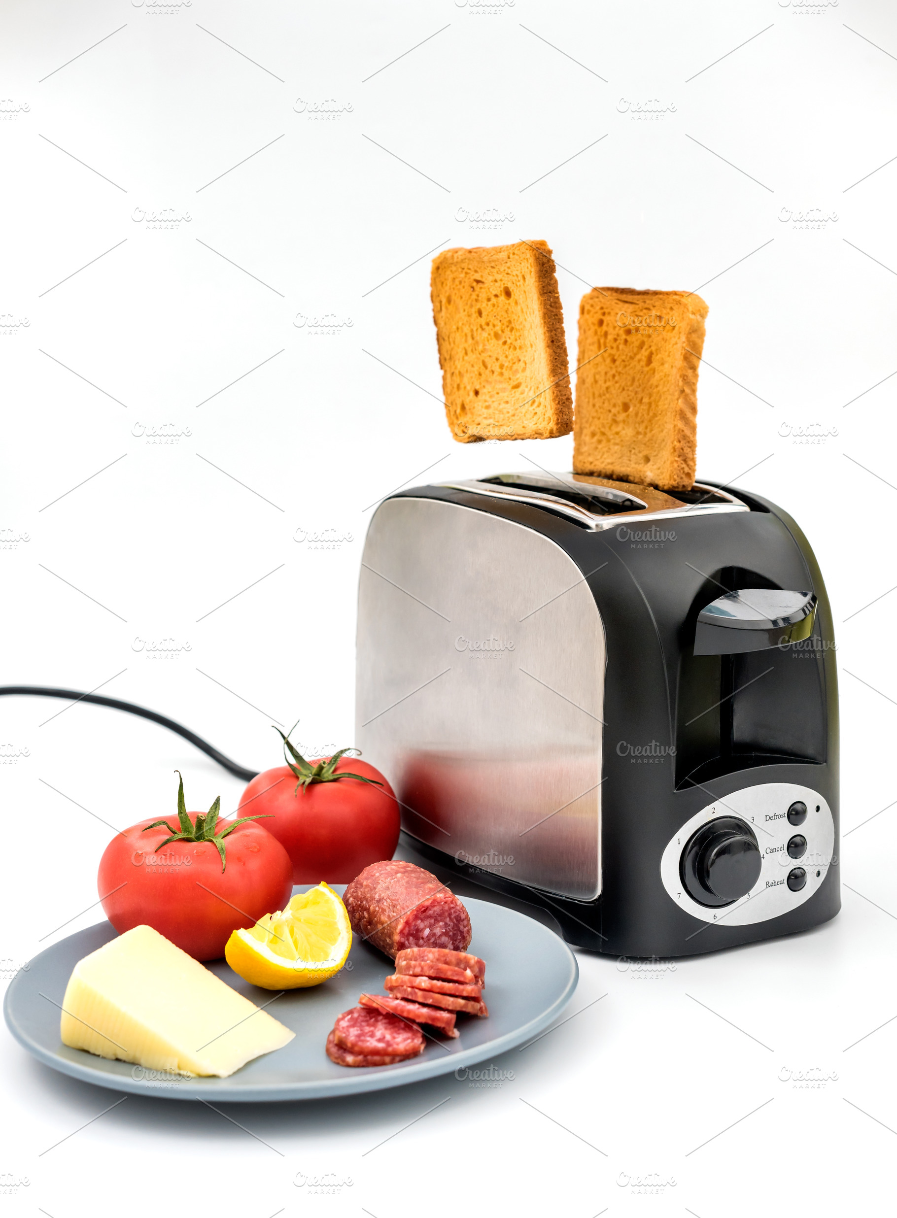 Toasts jumping out of toaster containing appliance, bakery, and bread, a Food & Drink Photo by wr7 Media