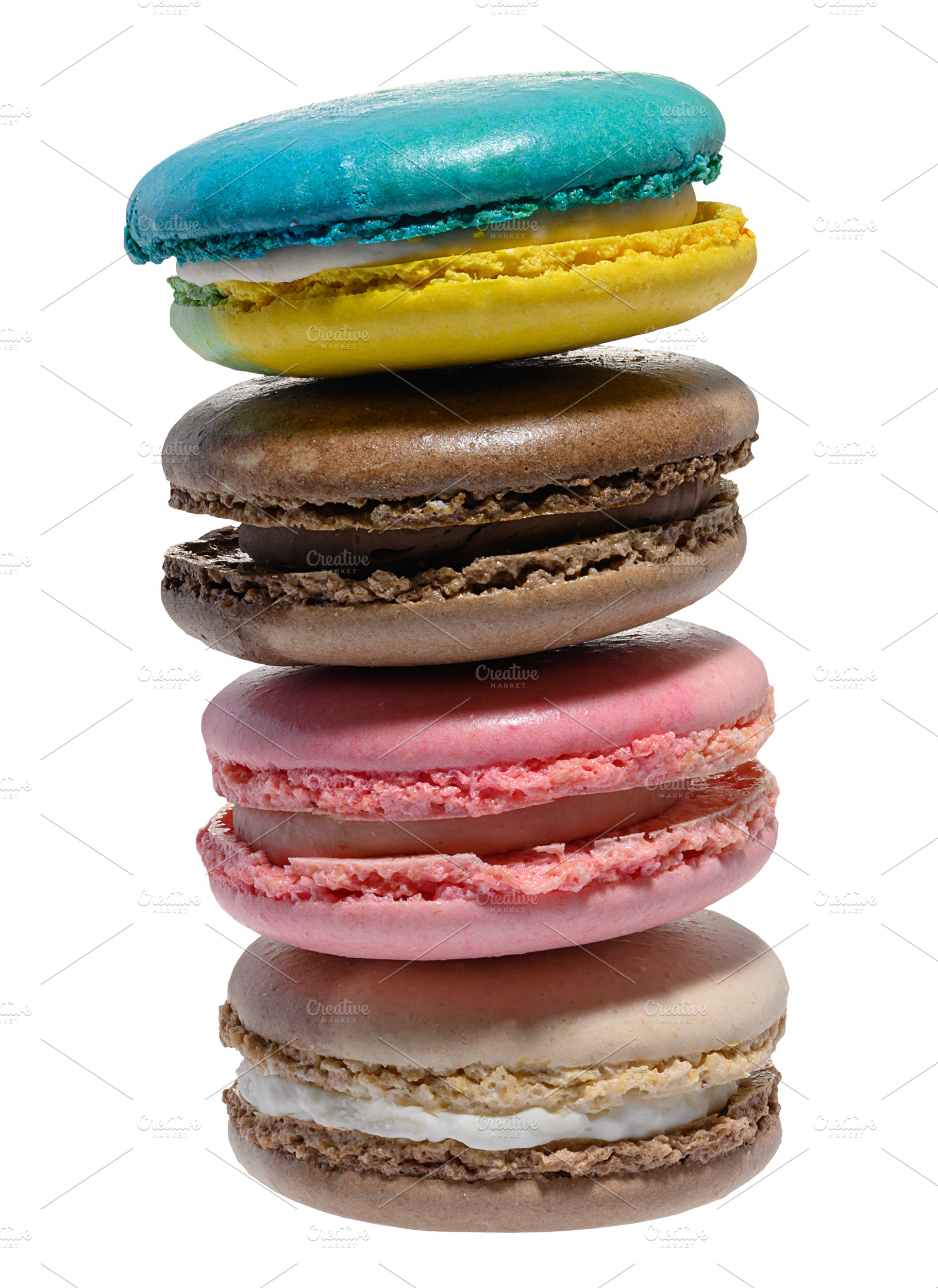 A vertical stack of four colorful macarons blue, yellow, brown,, a Food & Drink Photo by ndanko