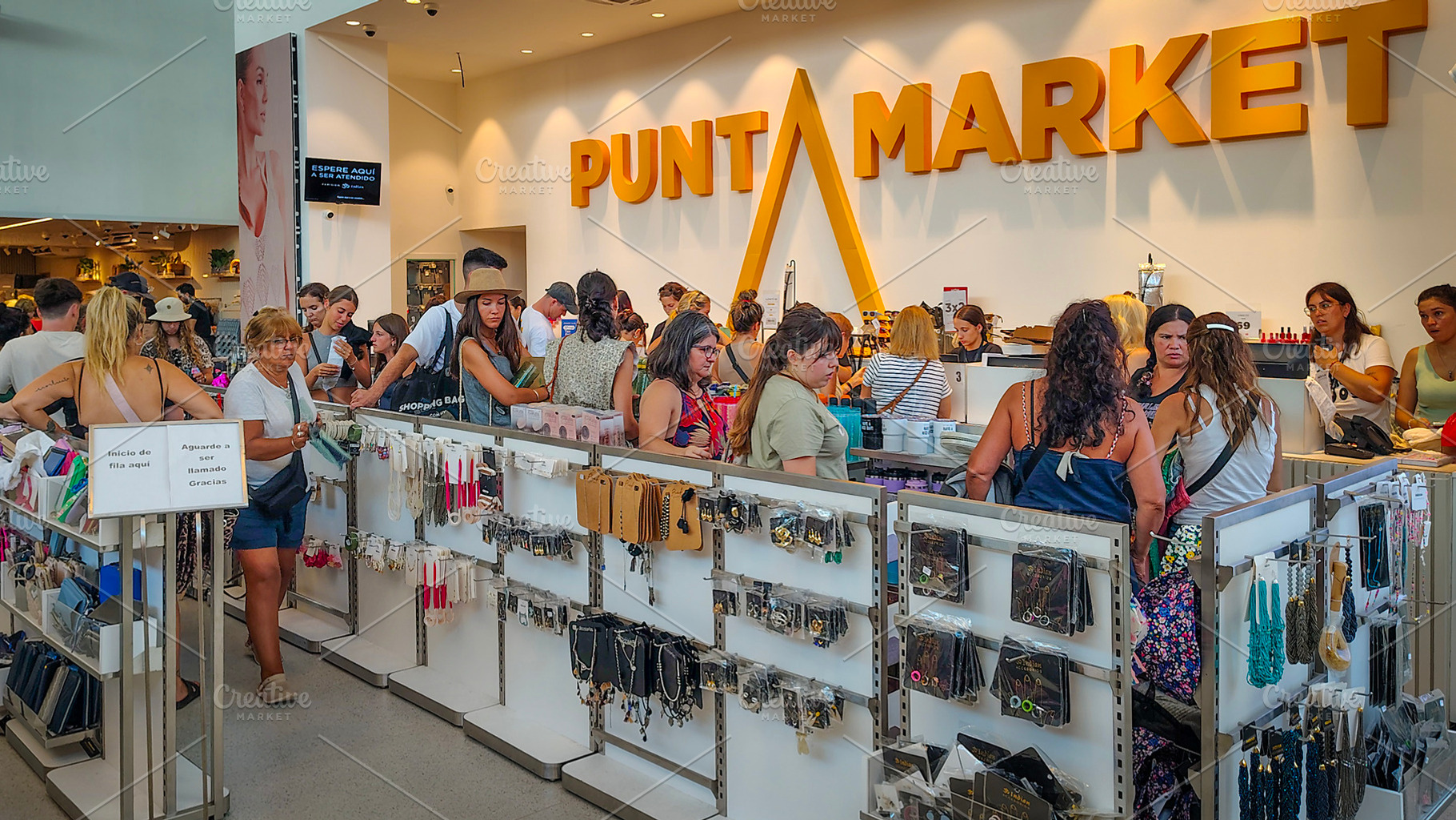 Shoppers inside bright mall under punta market business, a Business Photo by DanFLCreativo