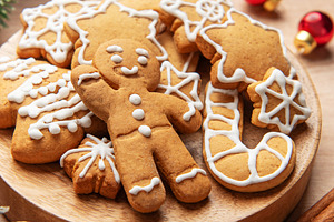 Gingerbread cookies on wooden plate with christmas decor, a Holiday Photo by Olena Rudo
