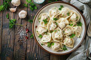 Homemade meat dumplings on wooden table, a Food & Drink Photo by AlyaAnd