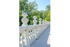 Ornate white balustrade in lush, an Architecture Photo by Lermont51