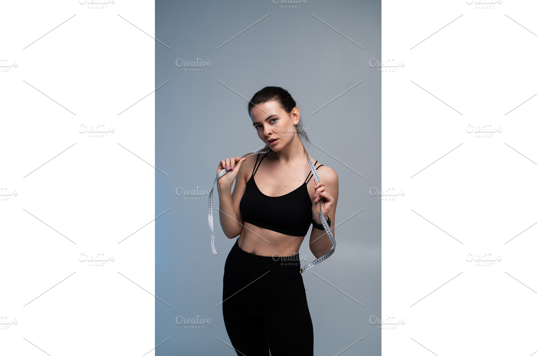 Young woman posing with a measuring, a Sports & Recreation Photo by volodymyrshtun13795