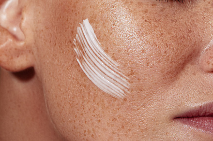 Freckled female skin with a cream, a Person Photo by Artem Varnitsin