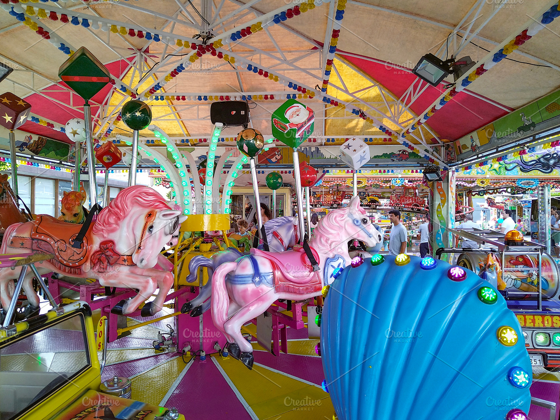 Bright carousel with colorful lights and horses, an Arts & Entertainment Photo by DanFLCreativo